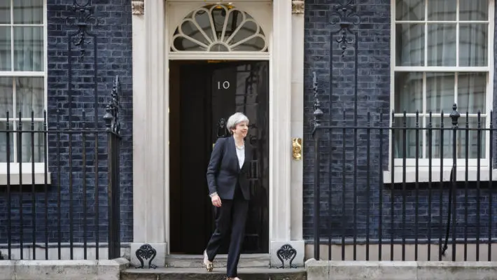 Theresa May has been accused of "caving in" to Conservative Brexiteers
