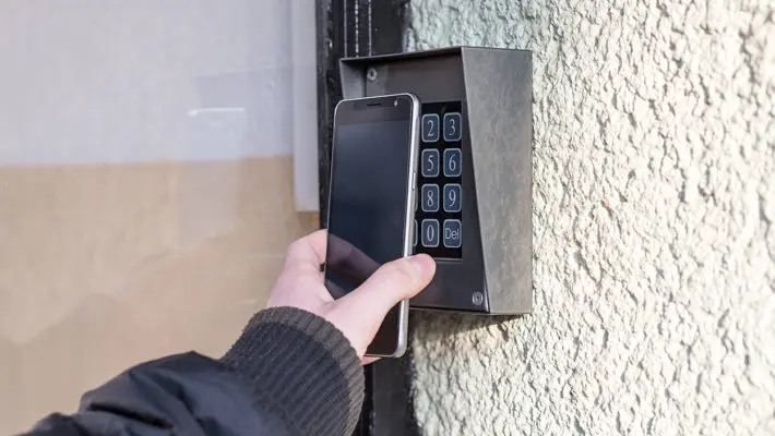 Man open the safety door with smart phone