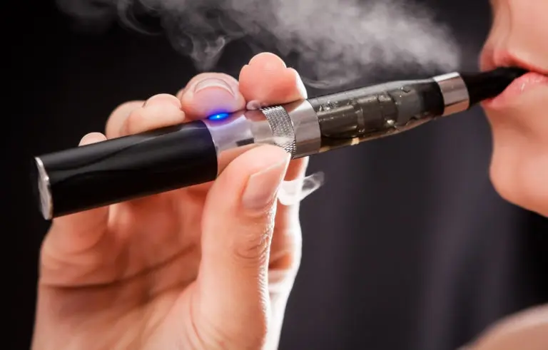 Woman smoking with electronic cigarette