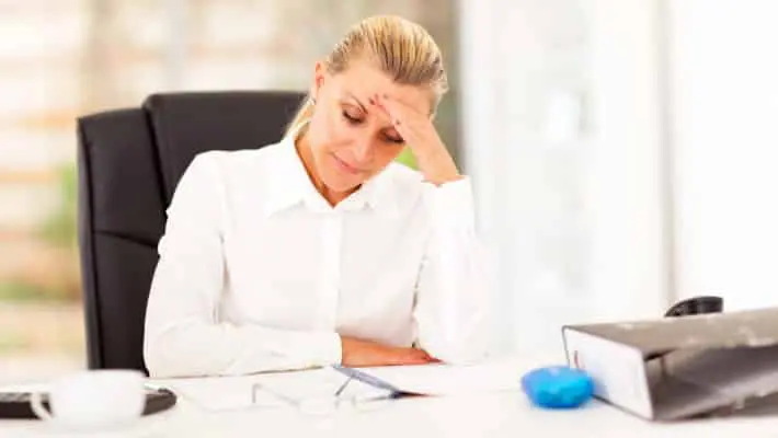 middle aged businesswoman looking worried