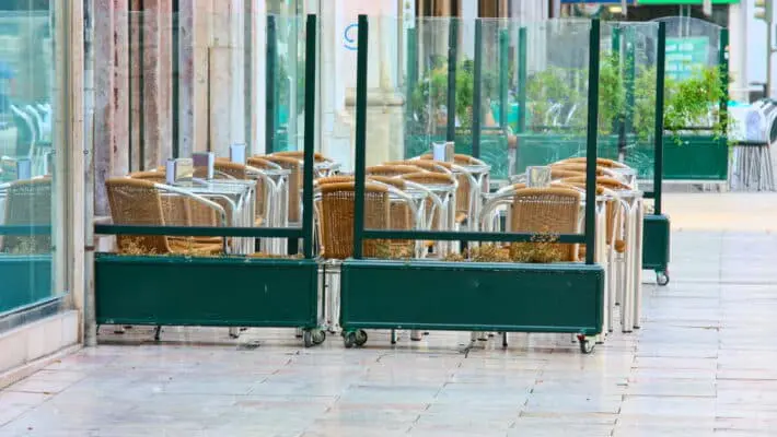 empty tables in street cafe