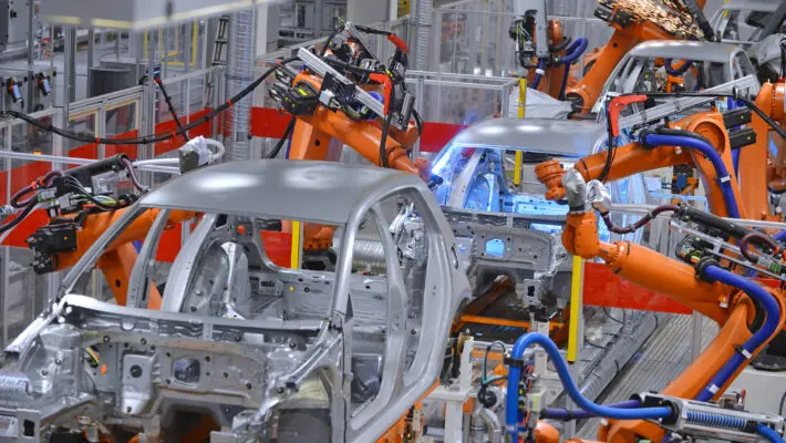 robots welding in factory