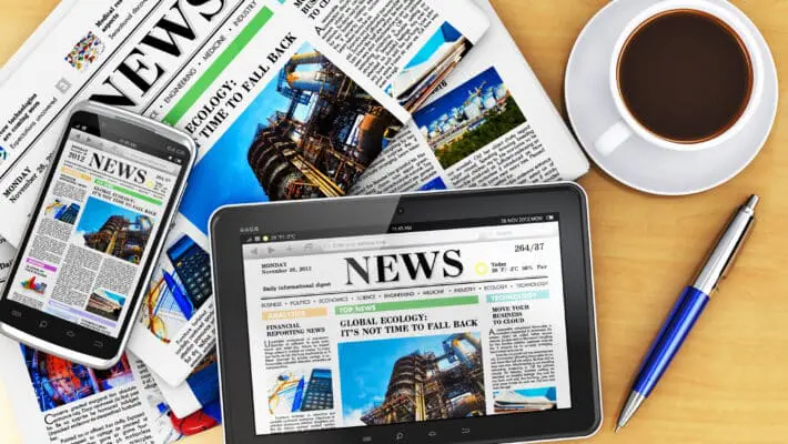 Tablet computer, smartphone and newspapers