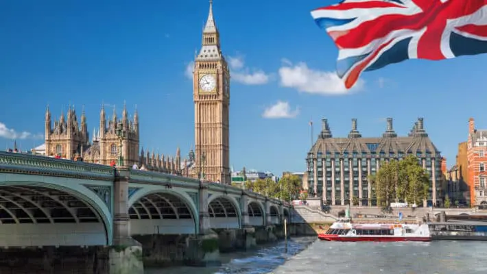 Big Ben and Houses of Parliament with boat in London, England, U