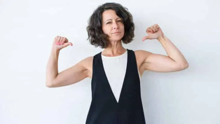 Confident woman pointing at herself