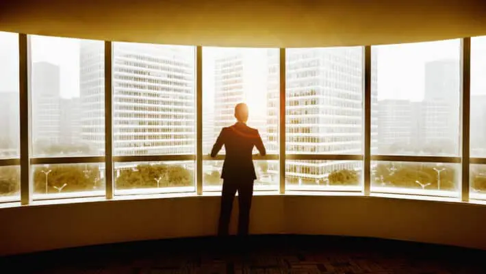 Business Man looking out the window