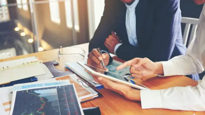 Two,Businessmen,Are,Consulting,And,Planning,Business,Operations.