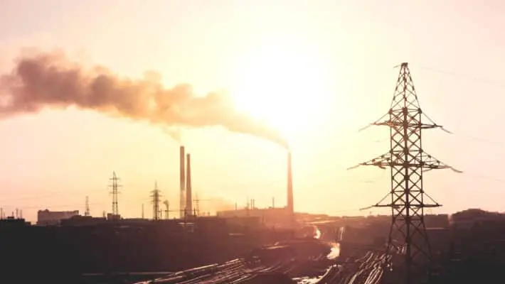 Air,Pollution,Smoke,From,Pipes,And,Factory,With,Sunset,Background