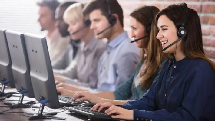 Positive,Female,Customer,Services,Agent,With,Headset,Working,In,A