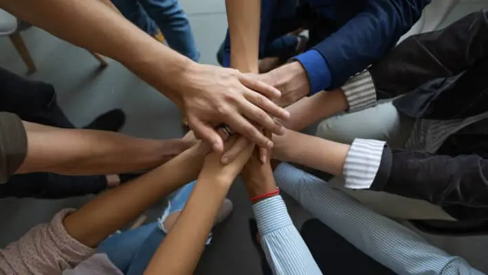 Close,Up,Mixed,Race,Business,People,Putting,Hands,Together,,Support