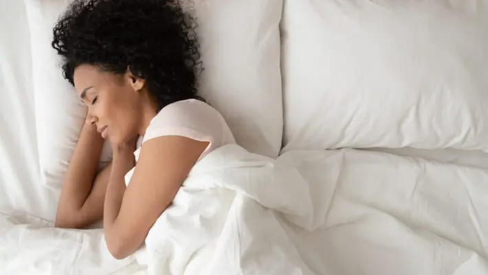 Serene,Calm,African,American,Woman,Sleeping,In,Comfortable,Bed,Lying