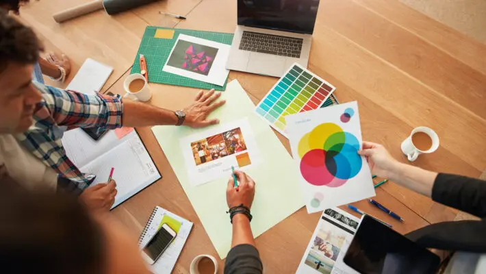Top,View,Shot,Of,Group,Of,Creative,Designers,Discuss,The