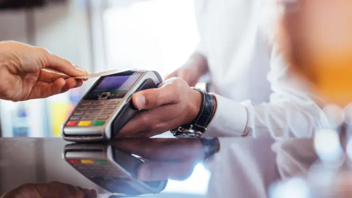 Hand,Of,Customer,Paying,With,Contactless,Credit,Card,With,Nfc