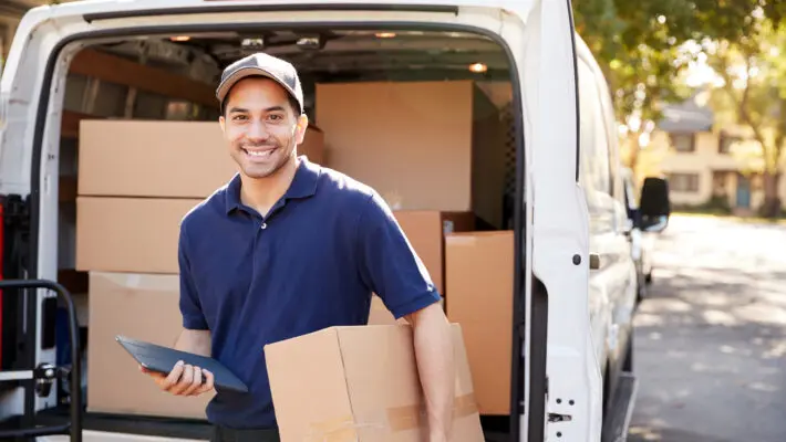 Portrait,Of,Courier,With,Digital,Tablet,Delivering,Package