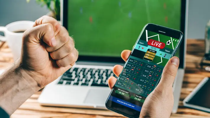 Lucky,Man,Celebrating,Victory,After,Making,Bets,Using,Gambling,Mobile