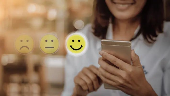 Businesswoman,Pressing,Face,Emoticon,On,Virtual,Touch,Screen,At,Smartphone
