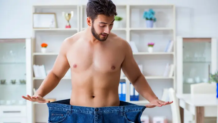 Man,In,Oversized,Pants,In,Weight,Loss,Concept
