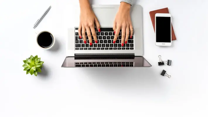 Female,Hands,Working,On,Modern,Laptop.,Office,Desktop,On,White