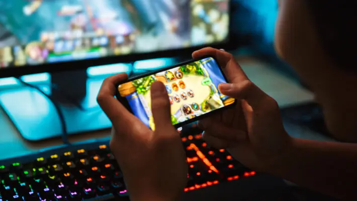Portrait,Of,Teenage,Gamer,Boy,Playing,Video,Games,On,Smartphone