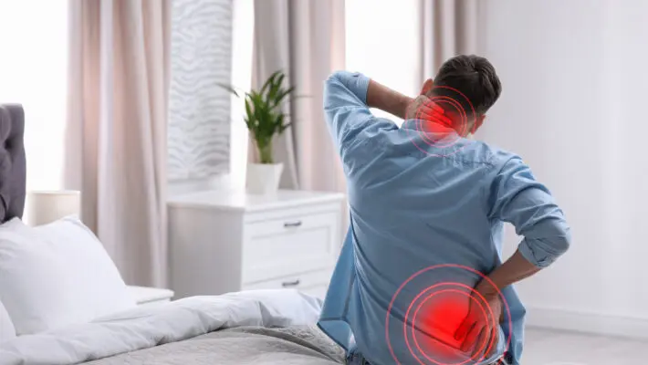 Man,Suffering,From,Back,Pain,After,Sleeping,On,Uncomfortable,Mattress