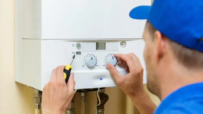 Worker,Set,Up,Central,Gas,Heating,Boiler,At,Home