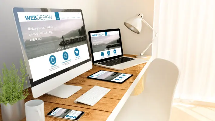Digital,Generated,Devices,Over,A,Wooden,Table,With,Responsive,Design