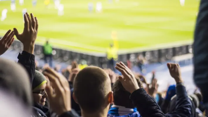 Hand,Fans,Who,Clap,Their,Hands,At,The,Stadium