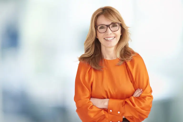 Portrait of executive middle aged businesswoman looking at camer