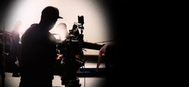 Behind,Video,Camera,In,Film,Or,Movie,Production,On,Tripod