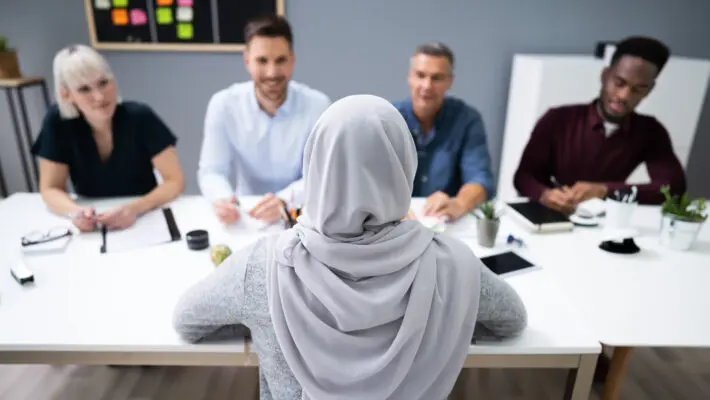 Muslim,Woman,In,Hijab,Sitting,At,Interview,In,Office