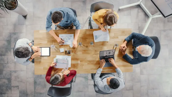 Startup,Meeting,Room:,Team,Of,Entrepreneurs,Sitting,At,The,Conference