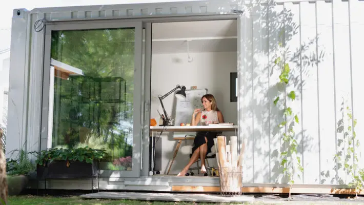 Mature,Woman,Working,Indoors,In,Home,Office,In,Container,House