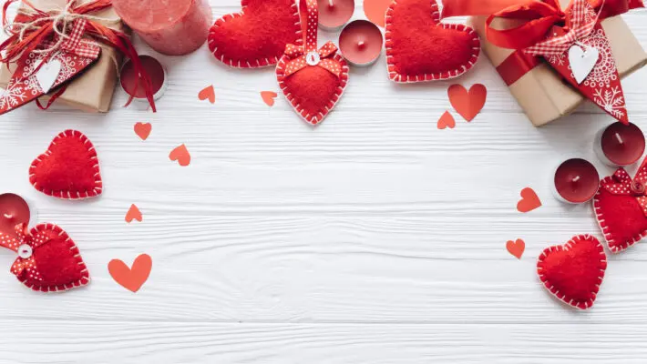 Wooden,White,Background,With,Red,Hearts,,Gifts,And,Candles.,The