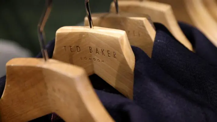 A “for sale” sign has been hoisted by Ted Baker’s board after the fashion brand received a sweetened takeover proposal from a US private equity firm and rival bid interest.