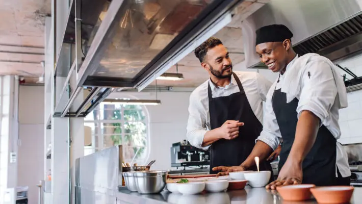 Restaurants and hotels in tourist resorts are paying thousands of pounds in golden handshakes to attract chefs from India and South Africa amid extreme staff shortages.