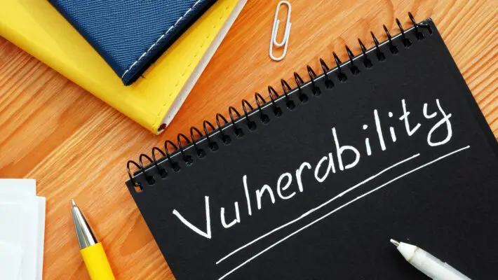 Vulnerability,Is,Written,In,White,Pencil,On,A,Black,Page.