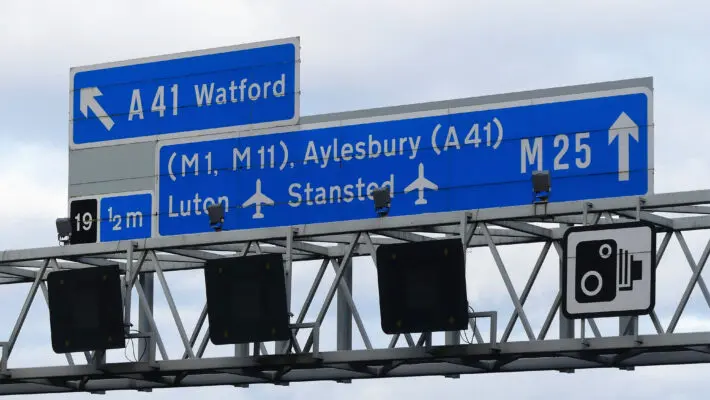 Climate activists climbed gantries on the M25 and declared the motorway a “site of civil resistance” as they pledged to block it for two days.