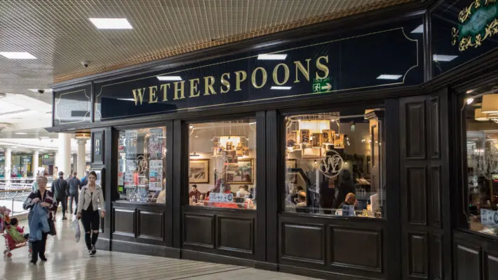 Pub giant JD Wetherspoon has announced it will sell off 32 pubs across the UK due to rising costs.