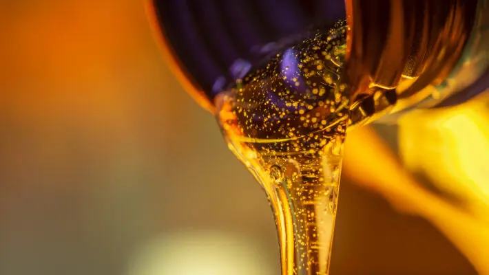 Liquid,Stream,Of,Motorcycle,Motor,Oil,Flows,From,The,Neck