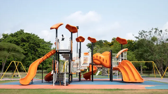 The,Outdoor,Playground,In,The,Daytime,Has,A,Backdrop,Of