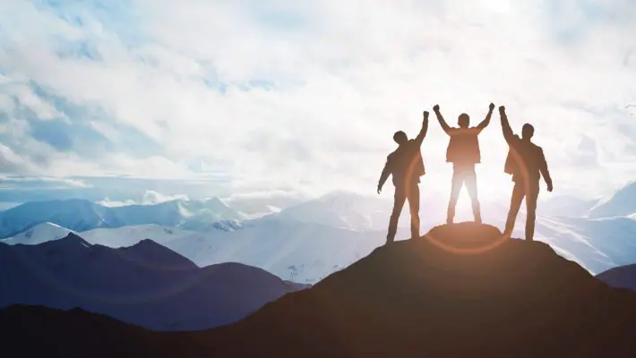 Silhouette,Of,The,Team,On,The,Mountain.,Leadership,Concept