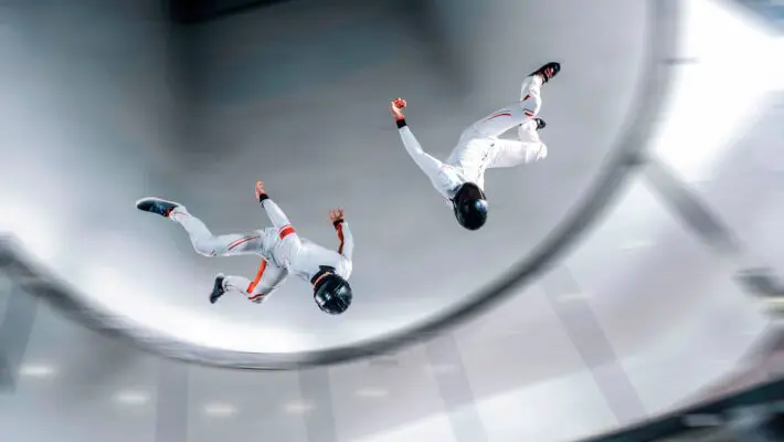 Fly,Men,Indoor,Skydive,Tunnel.,Two,Flyers,In,Wind,Tunnel.