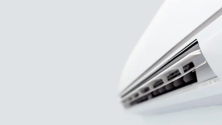 Air,Conditioner,Split,Hanging,On,The,Wall.,Cooling,Device,In