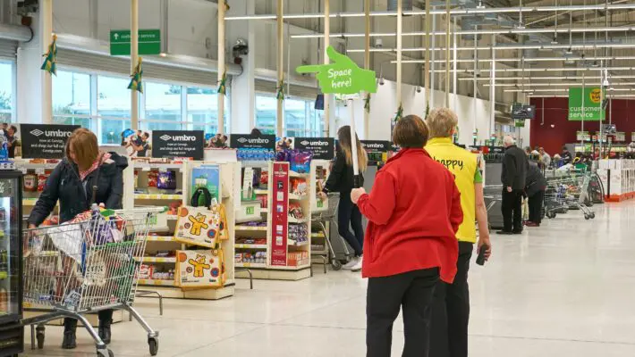 Supermarket chain Asda is considering whether to cut the pay of 7,000 staff in the south east of England to bring it in line with its other stores.