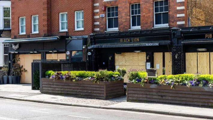 The number of pubs in England and Wales that shut their doors for good rose sharply in the first half of 2023, prompting warnings to the government that planned rises in business rates could force further closures in the beleaguered sector. Figures show that 383 pubs, or more than two a day, “vanished” in the first six months of this year, almost matching the total for the whole of 2022, when 386 were lost. The data, from the commercial real estate analysts Altus Group, measures the number of pubs that have closed down permanently because they have either been demolished or converted for use as homes or offices. The chief executive of one of Britain’s leading pub groups joined Altus in warning the chancellor, Jeremy Hunt, that more closures could follow if he goes ahead with plans to scrap a discount on business rates. Chris Jowsey, the chief executive of 1,000-strong chain Admiral Taverns, said the relief was vital for many pubs. “Without it, costs for many pubs will rise dramatically by many thousands of pounds, fuelling inflation and forcing closure for many independents,” he said. “Having survived Covid-19 and the cost of living crisis, it would be tragic if the government now chose to increase rates bills and brought about pub closures.” Pubs, like other hospitality, leisure and retail businesses, now benefit from a 75% discount on their business rate bills, capped at £110,000. Hunt announced the £2.1bn relief scheme at his autumn statement in November 2022, but the discount is scheduled to end in March 2024. The effect of the relief being phased out will be exacerbated by a scheduled rise in the headline business rates in line with inflation, an increase set to take effect in April next year. This could add 6% to bills, Altus Group said, calling on Hunt to continue rate relief beyond March next year. “With energy costs up 80% year-on-year, in a low-growth, high-inflation and high interest rates environment, the last thing pubs need is an average business rates hike of £12,385 next year,” said Alex Probyn, the head of property tax at Altus Group. The pubs industry, one of the hardest-hit by the restrictions on socialising imposed during the pandemic, has struggled to recover in the face of sky-high energy bills, the soaring cost of ingredients and difficulties in hiring staff. skip past newsletter promotion Sign up to Business Today Free daily newsletter Get set for the working day – we'll point you to all the business news and analysis you need every morning Privacy Notice: Newsletters may contain info about charities, online ads, and content funded by outside parties. For more information see our Privacy Policy. We use Google reCaptcha to protect our website and the Google Privacy Policy and Terms of Service apply. after newsletter promotion Britain’s biggest pub group, Stonegate – the owner of chains such as the Slug & Lettuce and Yates’s – has told patrons it will start charging them a 20p premium on pints during busy periods, such as the weekend. The Federation of Small Businesses (FSB) is also urging the government to extend the 75% rates relief discount for retail, hospitality and leisure businesses beyond next spring’s cutoff, and to increase the threshold for small business rates relief from £12,000 to at least £25,000. That would remove more than 250,000 small businesses from the rates system, they say. “For many small businesses on the high street and town centres, the current relief is a lifeline, said the FSB’s national chair, Martin McTague. “In April this is due to end, creating a cliff edge that will be hugely damaging to thousands of businesses. Ensuring the relief is maintained for those businesses that need it most will be key to their survival.”