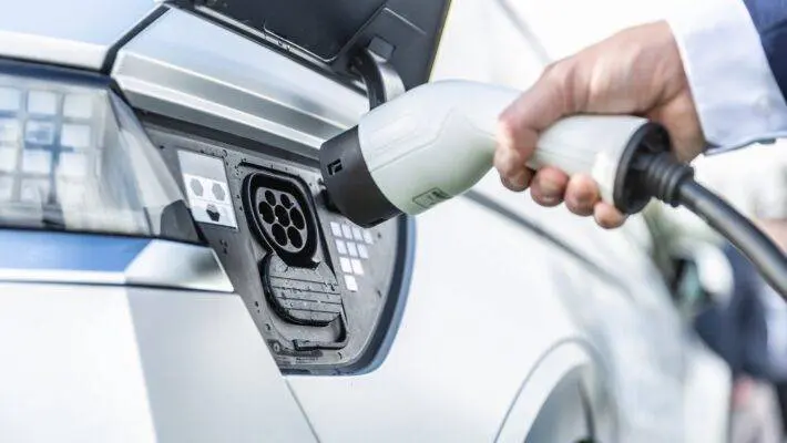 The number of new cars registered in the UK has jumped by nearly 18% but electric vehicle demand is flatlining, prompting the industry to call for a VAT cut to stimulate sales.