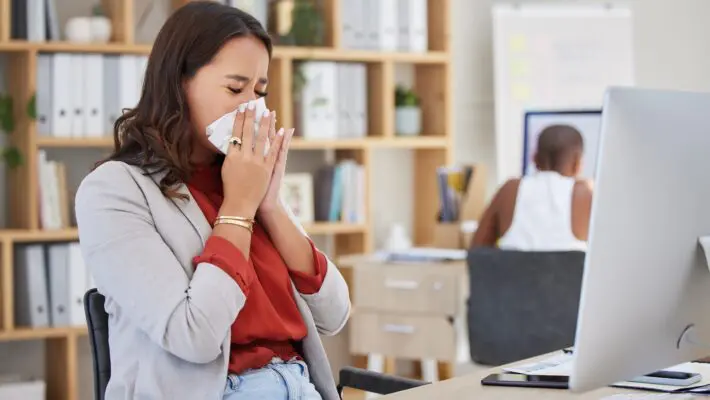 The rising tide of workplace sickness in the UK now costs over £100 billion annually, largely due to lost productivity caused by "staggering" levels of presenteeism, a new report reveals.