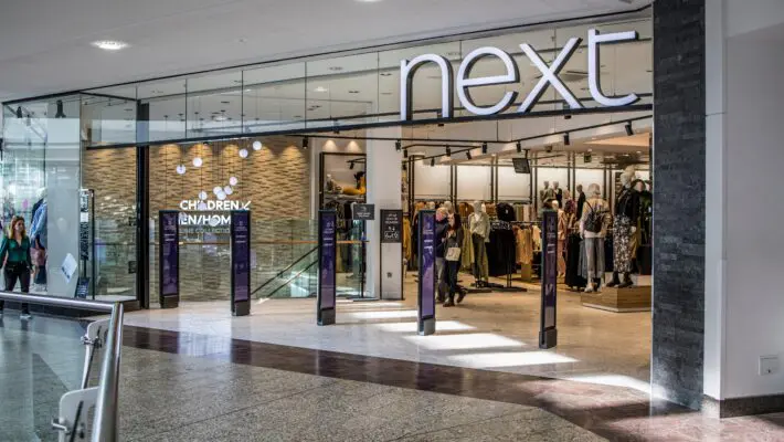 Next warns of possible store closures after losing a £30 million equal pay case involving female store staff. The retailer is appealing the ruling, which could impact profitability and lead to further high street closures.
