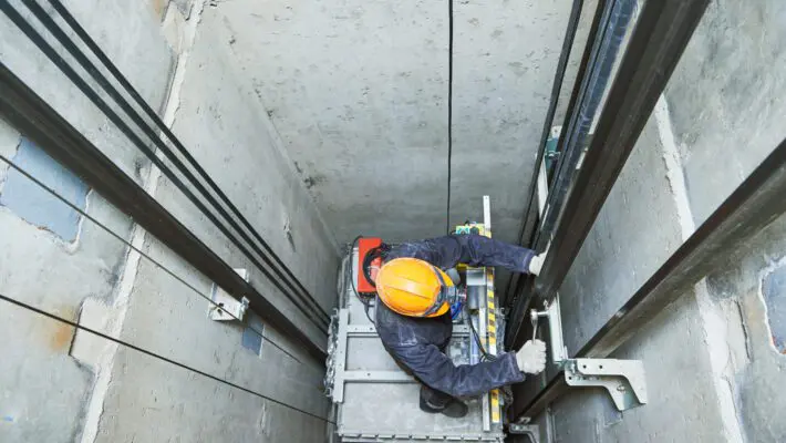 Lift modernization is a process where an existing elevator system is modified to improve its performance, safety, and efficiency characteristics.