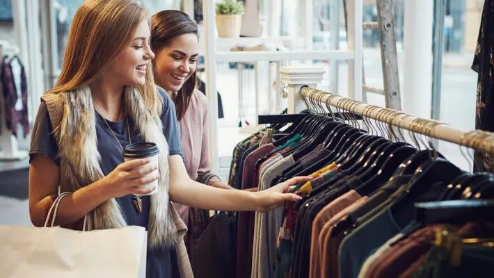 Shop price inflation remained subdued in February, confounding forecasts of a dramatic rise, as heavy discounting at fashion and non-food retailers helped keep prices in check.